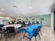 Large community room with lots of table seating, tile floors, and ceiling fans at 2290 Aaron St # 312, Port Charlotte, FL 33952