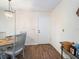 Dining area with wood floors and hanging light fixture at 2290 Aaron St # 312, Port Charlotte, FL 33952