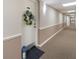 Hallway leading to Unit 312, featuring a wreath on the door, and lantern on the floor at 2290 Aaron St # 312, Port Charlotte, FL 33952