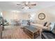 Open-concept living room and dining area with wood floors and ample natural light at 2290 Aaron St # 312, Port Charlotte, FL 33952