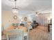 Living room with wood floors, chandelier-style lighting, and large windows at 2290 Aaron St # 312, Port Charlotte, FL 33952