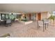 Common entrance area with outdoor seating, garden and access to mailbox area at 2290 Aaron St # 312, Port Charlotte, FL 33952