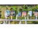 Aerial view of a row of homes, some with pools and solar panels, along a waterfront at 23240 Fullerton Ave, Punta Gorda, FL 33980