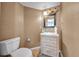 Cozy powder room featuring modern vanity with drawers and decorative light fixture at 23240 Fullerton Ave, Punta Gorda, FL 33980