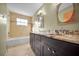 A bathroom featuring double sinks, granite countertop, tub and tiled shower at 23240 Fullerton Ave, Punta Gorda, FL 33980