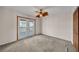 Bedroom featuring a ceiling fan and access to a balcony at 23240 Fullerton Ave, Punta Gorda, FL 33980