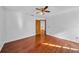 Spacious bedroom features hardwood floors and a ceiling fan at 23240 Fullerton Ave, Punta Gorda, FL 33980