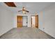 Bedroom features a ceiling fan, closet and ensuite access at 23240 Fullerton Ave, Punta Gorda, FL 33980