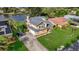 Stunning waterfront home with a well-manicured lawn, mature trees, and a private driveway at 23240 Fullerton Ave, Punta Gorda, FL 33980