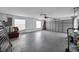 Spacious garage with a ceiling fan, ample storage, and an automatic door at 23240 Fullerton Ave, Punta Gorda, FL 33980