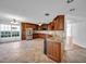 Spacious kitchen featuring wood cabinetry, stainless steel appliances, and a built-in wine rack at 23240 Fullerton Ave, Punta Gorda, FL 33980
