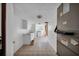 Practical laundry room with tiled floors, washer, and dryer hookups and convenient storage at 23240 Fullerton Ave, Punta Gorda, FL 33980