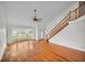 Spacious open concept living area with vaulted ceilings and staircase at 23240 Fullerton Ave, Punta Gorda, FL 33980