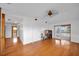 Open floor plan with hardwood floors and access to the balcony at 23240 Fullerton Ave, Punta Gorda, FL 33980