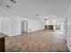 Bright living room featuring a fireplace, tile flooring, and views of the home's exterior at 23240 Fullerton Ave, Punta Gorda, FL 33980