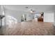 Spacious living room featuring tile floors, and sliding door access to the outdoor pool area at 23240 Fullerton Ave, Punta Gorda, FL 33980