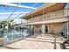 The screened-in pool and patio area offer a relaxing outdoor retreat with access to the home's upper balcony at 23240 Fullerton Ave, Punta Gorda, FL 33980