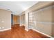 Spacious walk-in closet featuring wire shelving, wood floor and neutral paint at 23240 Fullerton Ave, Punta Gorda, FL 33980