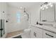 Modern bathroom featuring a glass shower, white subway tiles, and a granite vanity for a clean, fresh feel at 23451 Harper Ave, Port Charlotte, FL 33980