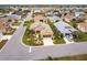 Aerial view of a residential neighborhood with well-maintained homes and landscaped yards at 24321 Kintail Ct, Punta Gorda, FL 33980