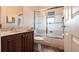 Bathroom featuring a vanity with sink and a shower/tub with sliding glass doors at 24321 Kintail Ct, Punta Gorda, FL 33980