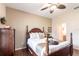 Bedroom featuring a four-poster bed, wood flooring, and neutral wall color at 24321 Kintail Ct, Punta Gorda, FL 33980