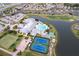 Community clubhouse with a resort-style pool, tennis courts and plenty of amenities at 24321 Kintail Ct, Punta Gorda, FL 33980