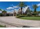 Exterior of the community clubhouse with palm trees, lush landscaping, and a welcoming entrance at 24321 Kintail Ct, Punta Gorda, FL 33980