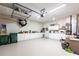 Spacious and organized garage with ample storage, shelving, lighting, and room for vehicles and projects, plus room for golf cart! at 24321 Kintail Ct, Punta Gorda, FL 33980