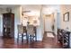 Inviting living area with hardwood floors, neutral decor, and a sliding glass door to the patio at 24321 Kintail Ct, Punta Gorda, FL 33980