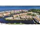 An aerial view features waterfront homes along canals, showcasing a coastal community at 25188 Marion Ave # 1015, Punta Gorda, FL 33950