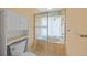 Cozy bathroom featuring a shower-tub combination and built-in storage at 25188 Marion Ave # 1015, Punta Gorda, FL 33950