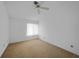 Bedroom with a single window and a ceiling fan at 25188 Marion Ave # 1015, Punta Gorda, FL 33950