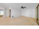 Neutral bedroom features carpet, ceiling fan, a closet with mirrors and access to an en-suite at 25188 Marion Ave # 1015, Punta Gorda, FL 33950