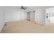A bright bedroom with mirrored closet doors at 25188 Marion Ave # 1015, Punta Gorda, FL 33950