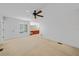Spacious bedroom with carpet, ceiling fan, ensuite bathroom and bright natural light at 25188 Marion Ave # 1015, Punta Gorda, FL 33950