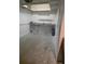 A spacious garage with a workbench and utility lighting at 25188 Marion Ave # 1015, Punta Gorda, FL 33950