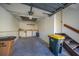 Garage with built-in workbench and access to stairs at 25188 Marion Ave # 1015, Punta Gorda, FL 33950