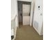 Laundry closet with stacked washer and dryer located on the second floor at 25188 Marion Ave # 1015, Punta Gorda, FL 33950