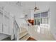 Bright living room with tiled floors, a cozy fireplace, and access to outdoor space at 25188 Marion Ave # 1015, Punta Gorda, FL 33950