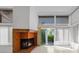 Bright living room featuring a fireplace and a sliding glass door to the outside balcony at 25188 Marion Ave # 1015, Punta Gorda, FL 33950