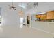 Open-concept living space with a fireplace, staircase to the second level, and a combined kitchen area at 25188 Marion Ave # 1015, Punta Gorda, FL 33950