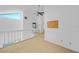 Spacious loft area with high ceilings and a ceiling fan at 25188 Marion Ave # 1015, Punta Gorda, FL 33950