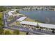 Community aerial featuring the building, parking and lake at 25225 Rampart Blvd # 604, Punta Gorda, FL 33983