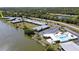 Aerial view of lakefront condos and community pool, showcasing the desirable location at 25225 Rampart Blvd # 604, Punta Gorda, FL 33983