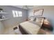 Serene bedroom featuring a comfortable bed, soft lighting, neutral tones, and a window with scenic views at 25225 Rampart Blvd # 604, Punta Gorda, FL 33983