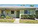 Cozy condo featuring a well-manicured lawn and a charming entrance, perfect for a relaxed living experience at 25225 Rampart Blvd # 604, Punta Gorda, FL 33983