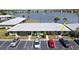 Inviting condo complex offering a picturesque view of the serene lake and lush landscaping in a convenient community at 25225 Rampart Blvd # 604, Punta Gorda, FL 33983