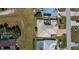 An aerial view showing backyard pools and neighboring houses at 26089 Templar Ln, Punta Gorda, FL 33983