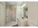 Neutral bathroom featuring a single sink vanity and walk-in shower at 26089 Templar Ln, Punta Gorda, FL 33983